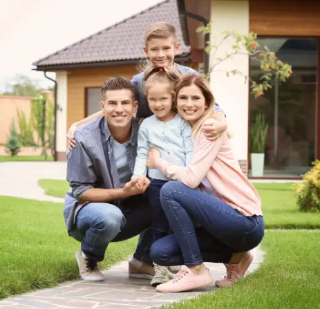 Family in front of house